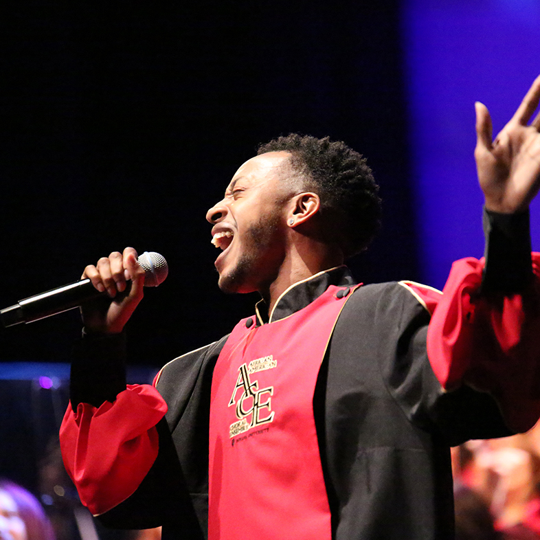 A male soloist sings with the African American Choral Ensemble